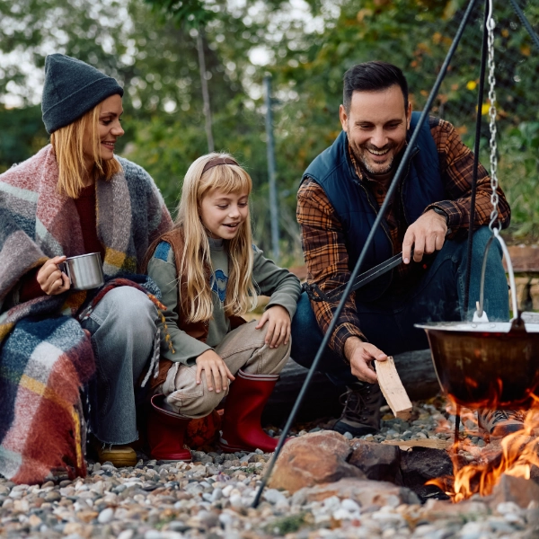 Family Of Three Camping Open Fire 600X600